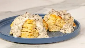 Air Fryer Biscuits and gravy on a blue plate