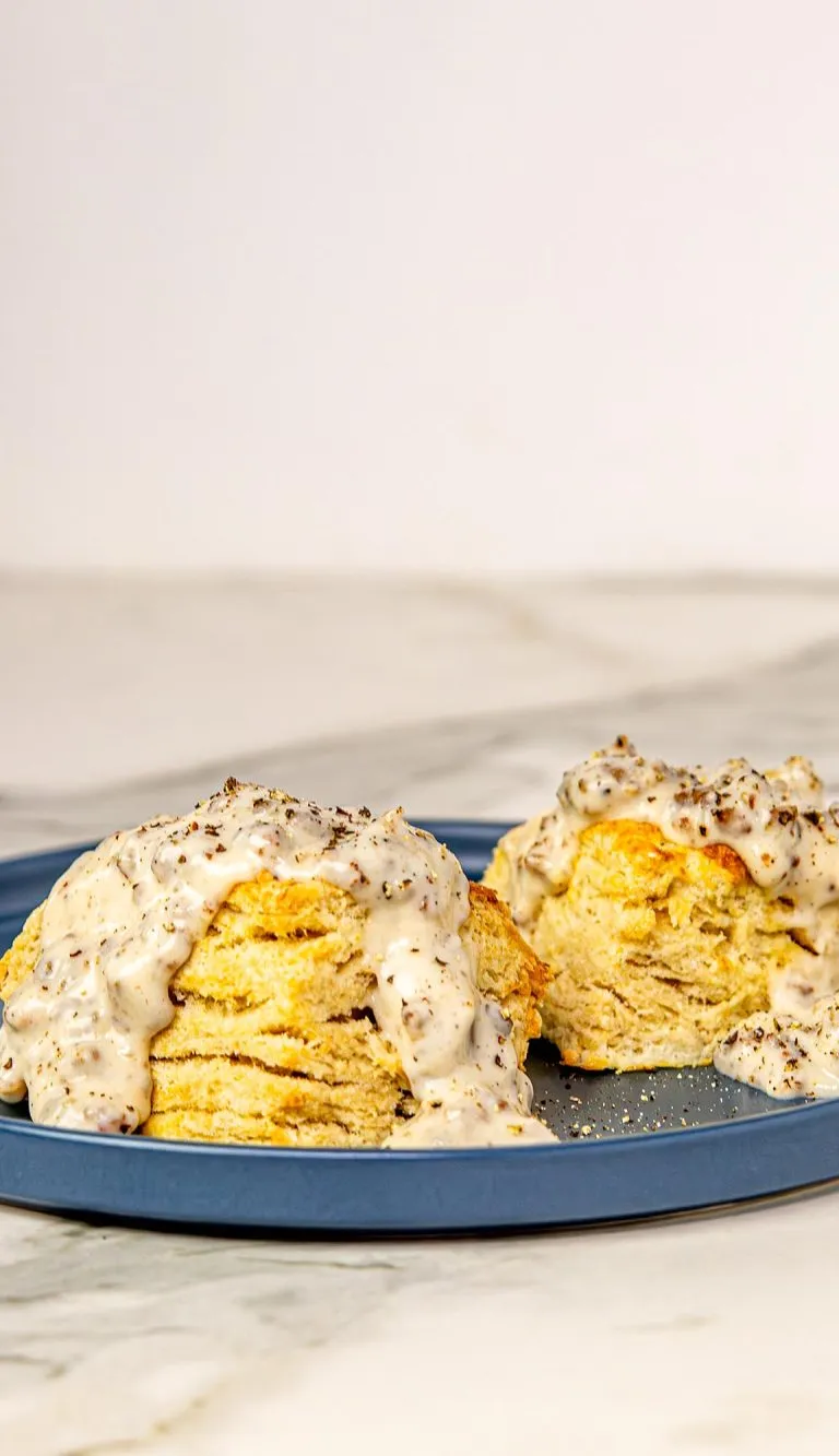 Air Fryer Biscuits and gravy on a blue plate