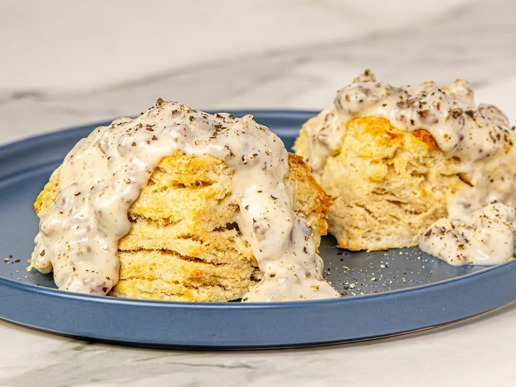Air Fryer Biscuits and gravy on a blue plate