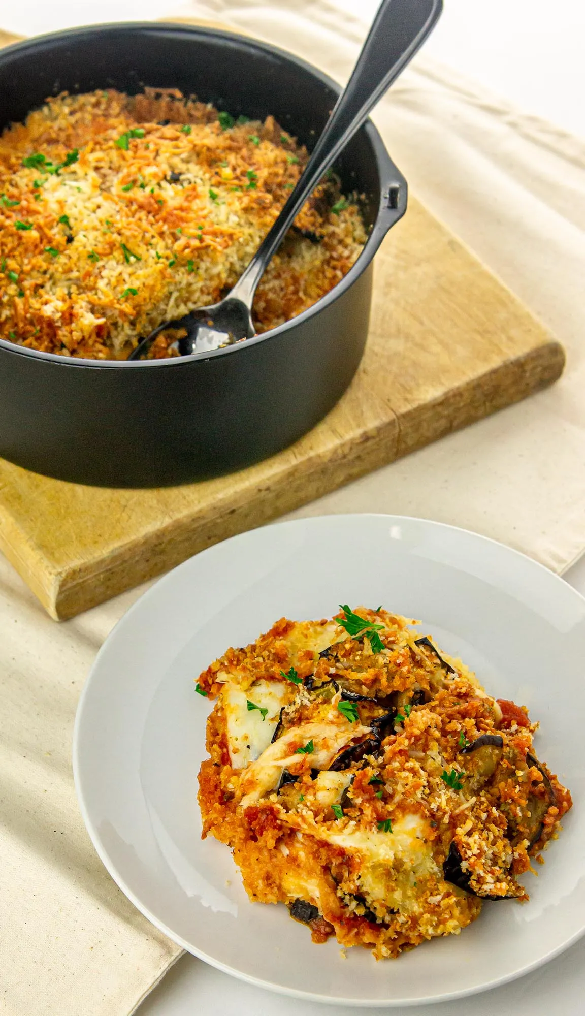 baked eggplant parmesan scooped out into a plate