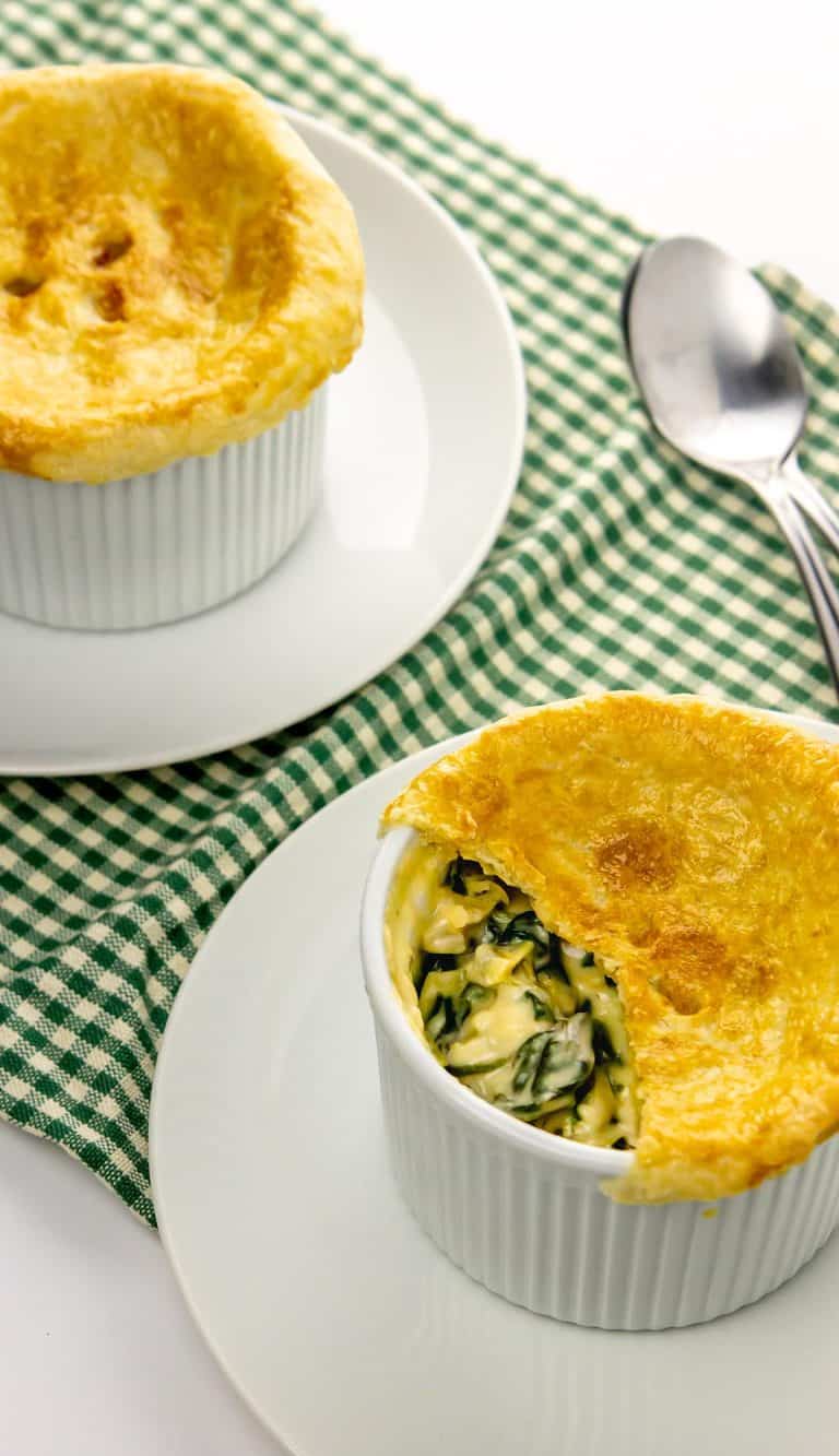 cut into pot pie with spinach and artichoke filling showing