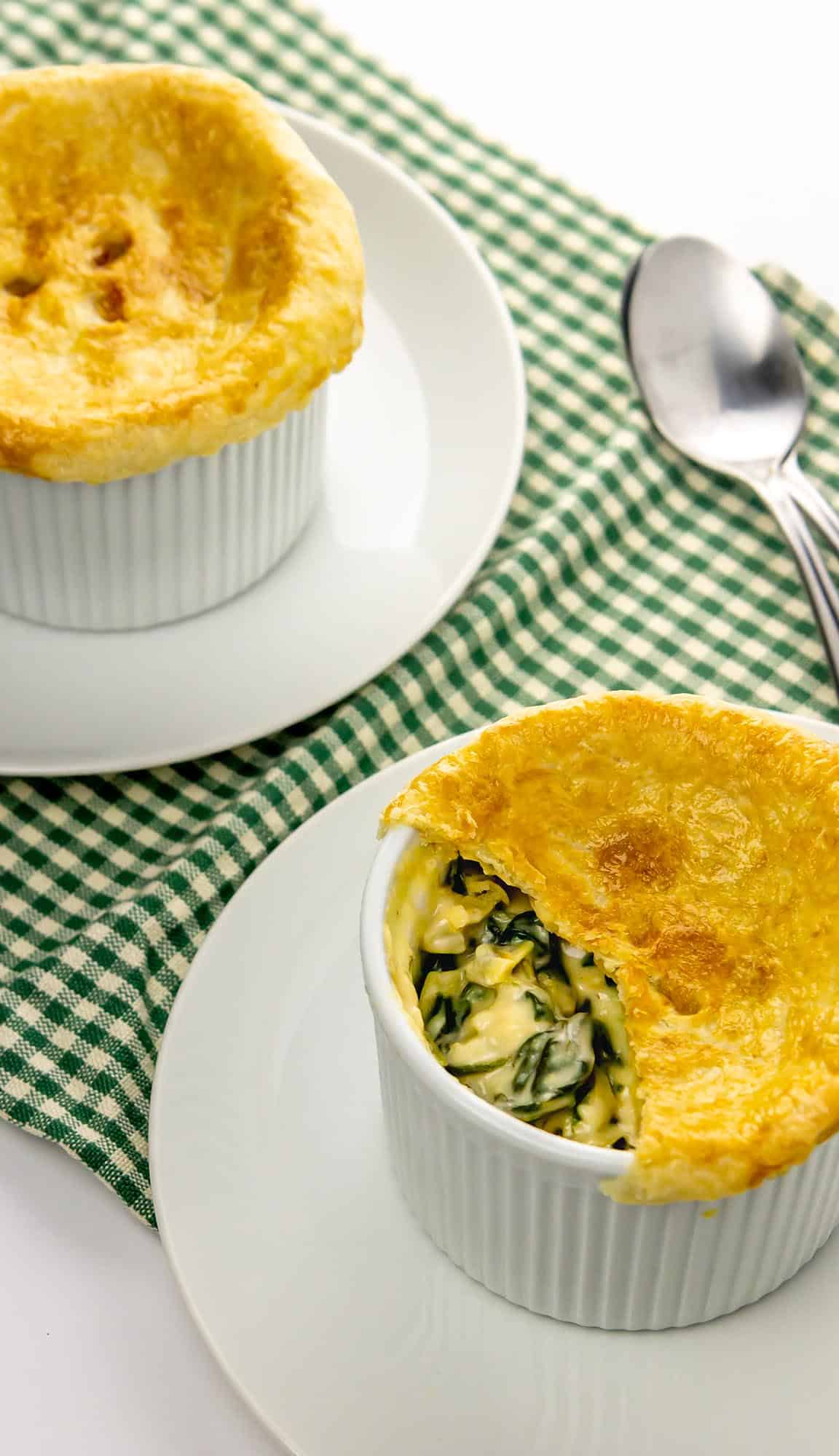 cut into pot pie with spinach and artichoke filling showing